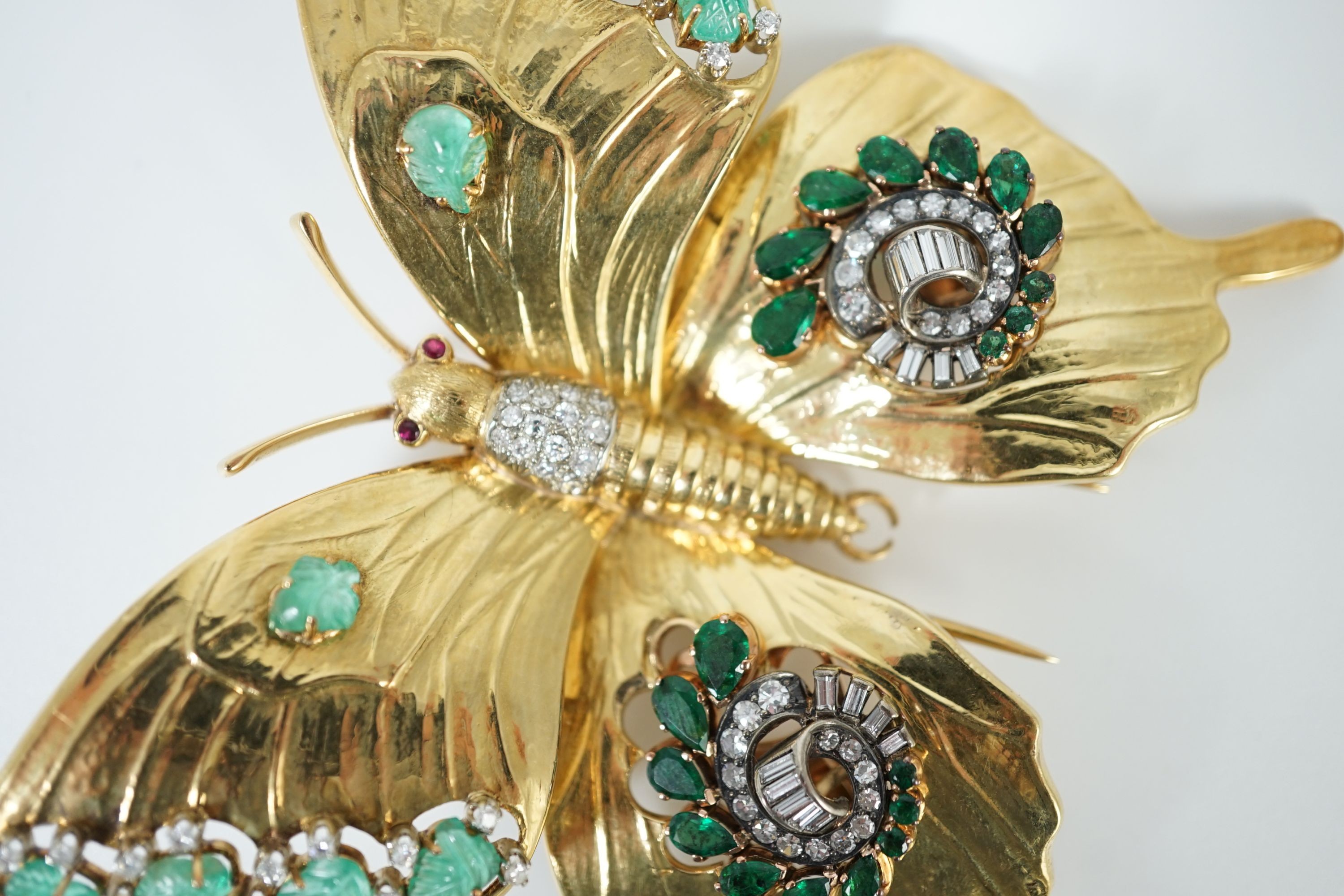A modern 18ct gold, emerald and diamond set butterfly clip brooch